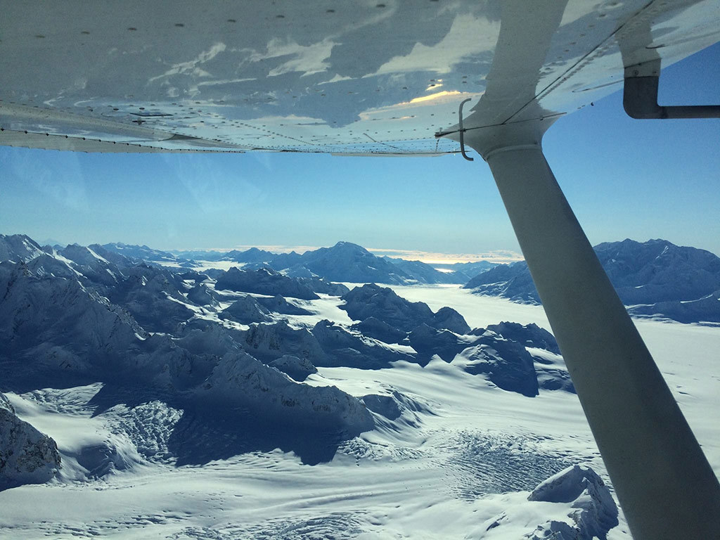 Snowy mountains and glaciers viewed from a plane